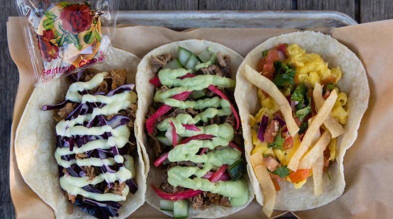 Three tacos from Strange Tacos in Lawrenceville (left to right): lamb, duck and migas. CONTRIBUTED BY HENRI HOLLIS