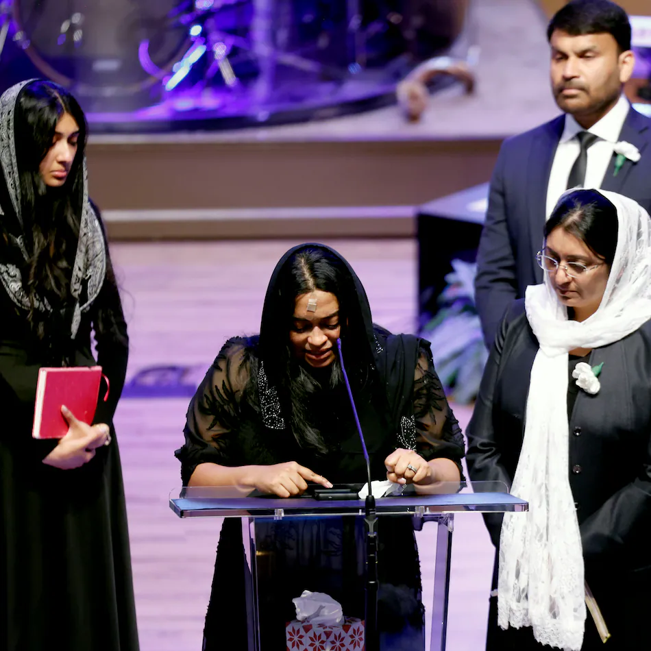 Jesni Sam speaks at her late husband's funeral on June 6, 2026, at Praise Community Church in Lawrenceville. She and Dave Fiji boarded a helicopter late May 29 after their Dawson County wedding, and the aircraft crashed not long after, killing Fiji. (Akili-Casundria Ramsess for the AJC)