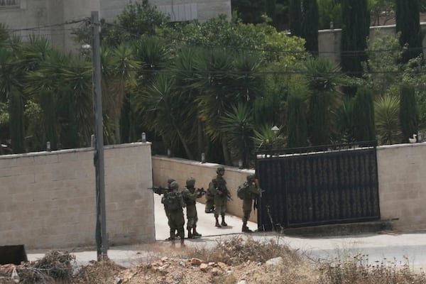 Israeli soldiers search a Palestinian village next to the West Bank settlement of Bruchin, the morning after a Palestinian gunman shooting killed Tzeela Gez, who was on her way to the hospital to give birth, Thursday, May 15, 2025. (AP Photo/Maya Alleruzzo)