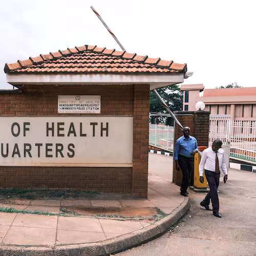 People walk out of the Ministry of Health's Headquarters in Kampala, Uganda, Tuesday, May 19, 2026. (AP Photo/Hajarah Nalwadda)