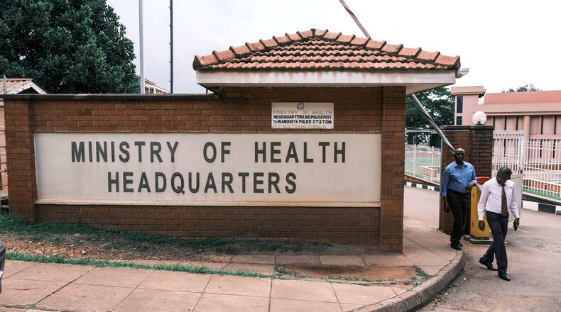 People walk out of the Ministry of Health's Headquarters in Kampala, Uganda, Tuesday, May 19, 2026. (AP Photo/Hajarah Nalwadda)