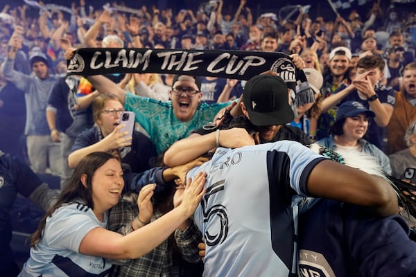Fans celebrate with Sporting Kansas City defender Dany Rosero after an MLS soccer wild-card playoff match against the San Jose Earthquakes Wednesday, Oct. 25, 2023, in Kansas City, Kan. Sporting Kansas City won in a penalty shootout to advance to the playoffs. (Charlie Riedel/AP)