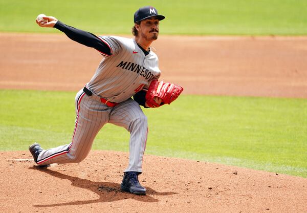 Minnesota Twins pitcher Joe Ryan (41) delivers a pitch against the Atlanta Braves during the first inning of a baseball game Saturday, April 20, 2025, in Atlanta. (AP Photo/ John David Mercer)
