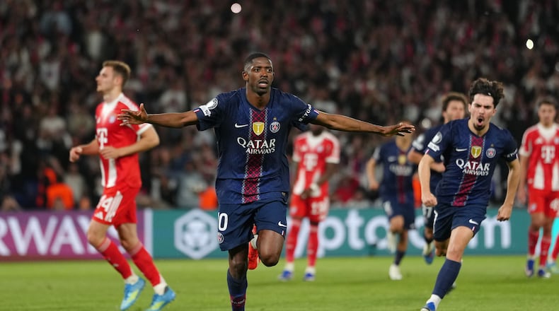 PSG's Ousmane Dembele celebrates after scoring his side's third goal during a Champions League semifinal, first leg, soccer match between Paris Saint-Germain and Bayern Munich in Paris, Tuesday, April 28, 2026. (AP Photo/Aurelien Morissard)