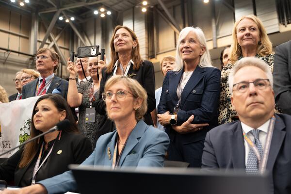 A Georgia contingent was on hand Saturday, July 25, 2026, to witness the Okefenokee National Wildlife Refuge being added to the UNESCO World Heritage List by the World Heritage Committee at its 48th annual session in Busan, South Korea. Front row from left are Tracie Revis, Kim Bednarek and Cyril Kormos. The back row from left are Joe Montgomery, Marise Nazzaro (holding camera), Rena Ann Peck, Claire LaBrunerie and Haile McCollum. (Hwawon Ceci Lee for the AJC)