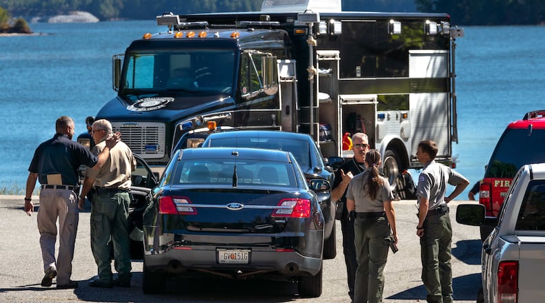 A woman's body was found by a fisherman Friday afternoon near Lake Lanier. Police said the body was "badly decomposed." GBI is investigating.