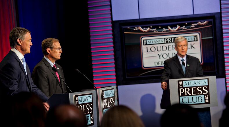 July 13, 2014 Atlanta - U.S. Senate Republican candidates David Perdue (left) and Jack Kingston answer questions from panelists as Dennis O'Hayer moderates during the Atlanta Press Club's Loudermilk-Young Debate Series at the Georgia Public Broadcasting studios in Atlanta on Sunday, July, 13, 2014. JONATHAN PHILLIPS / SPECIAL David Perdue (left) and Jack Kingston, Republican candidates for U.S. Senate, answer questions from panelists as Dennis O'Hayer moderates during a Sunday debate sponsored by the Atlanta Press Club. AJC/Jonathan Phillips