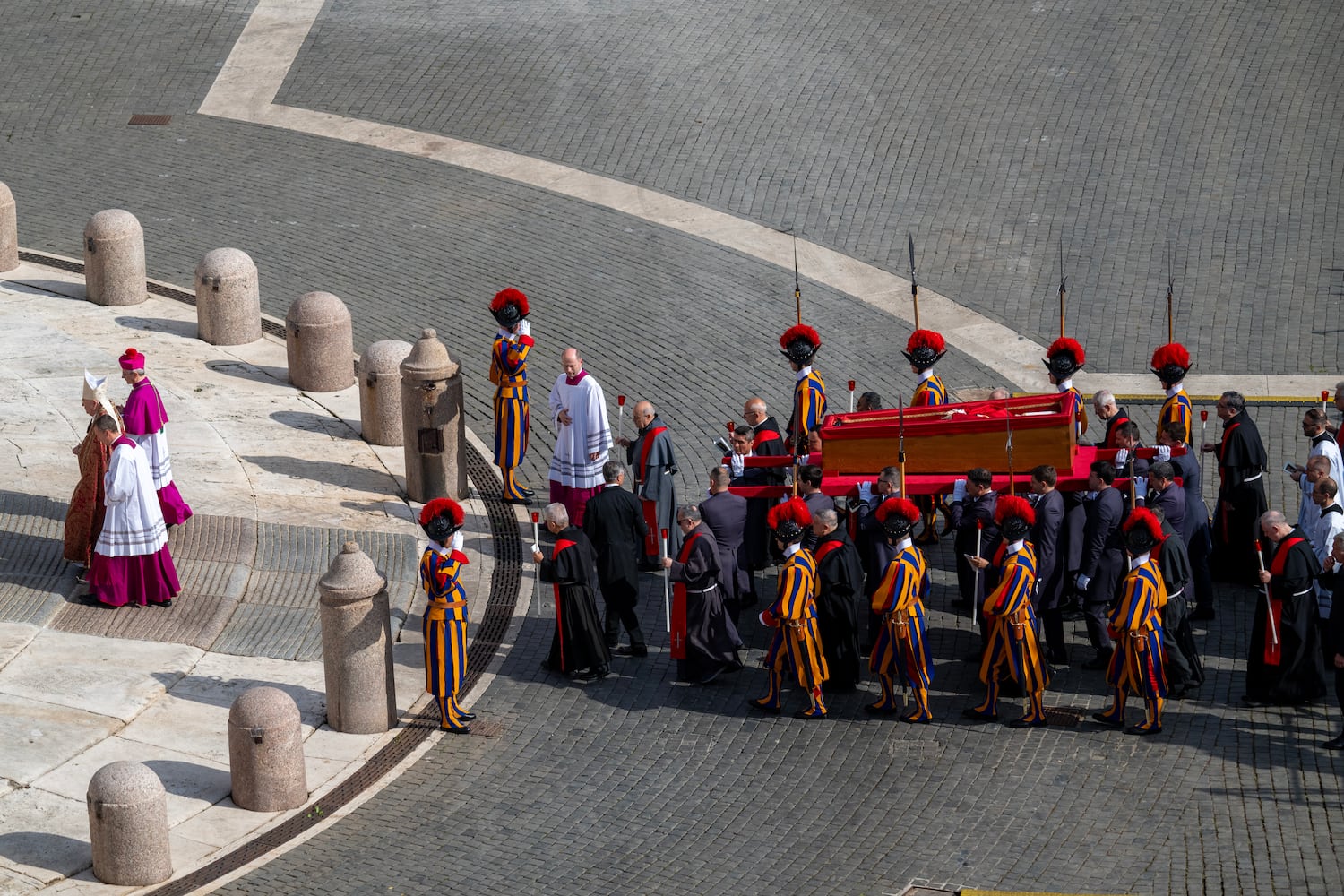 The body of Pope Francis is carried into St. Peter’s Basilica in Vatican City, April 23, 2025. (James Hill/The New York Times)