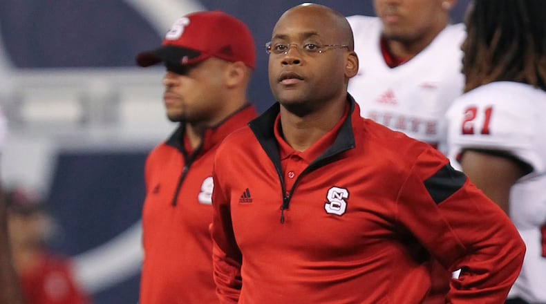26 December 2014: North Carolina State Wolfpack Running Backs coach Desmond Kitchings during Pre-Game before the 2014 BITCOIN St. Petersburg Bowl between the North Carolina State Wolfpack and the UCF Knights at Tropicana Field in St. Petersburg, Florida. (Icon Sportswire via AP Images)