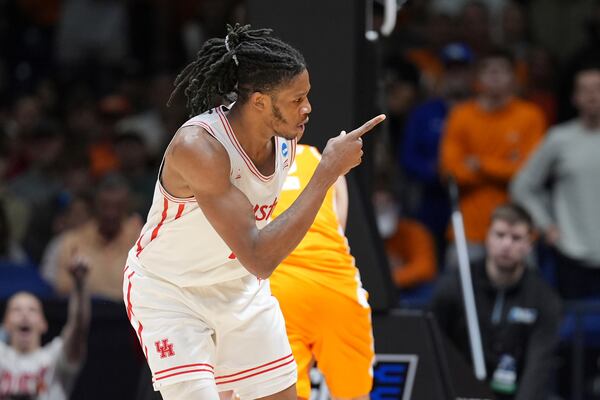 Houston's Joseph Tugler celebrates after scoring during the second half in the Elite Eight round of the NCAA college basketball tournament against Tennessee Sunday, March 30, 2025, in Indianapolis. (AP Photo/Michael Conroy)