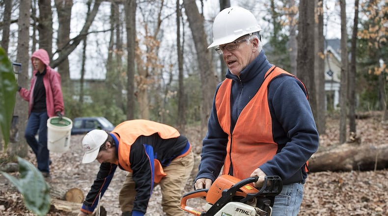 Walter Bland, whose company does contract work for the federal government in the Chattahoochee National Recreation Area and other federal sites that are on hold because of the shutdown, leads his crew while working in Deepdene Park on Thursday, Jan. 17, 2019, in Atlanta. Curtis Compton/ccompton@ajc.com