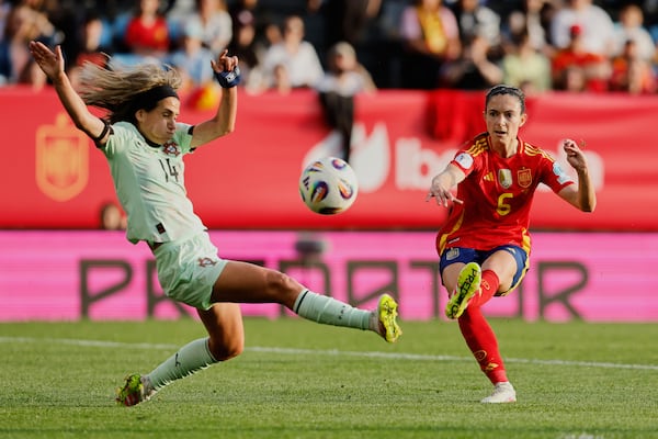 FILE - Spain's Aitana Bonmati, right, plays the ball past Portugal's Dolores Silvia during the Women's Nations League Group A3 soccer match between Spain and Portugal at the Balaidos stadium in Vigo, Spain, Tuesday, April 8, 2025. (AP Photo/Lalo Villar, File)