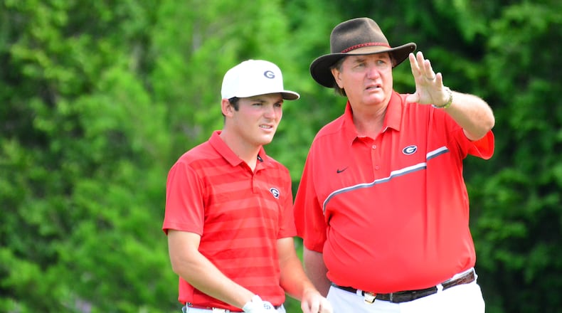 Georgia's Trent Phillips and coach Chris Haack discuss strategy during the NCAA Championships at Blessings Golf Club in Fayetteville, Ark., on Sunday, May 26, 2019. (Photo by Steven Colquitt/UGA Athletics)
