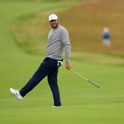Scottie Scheffler reacts after missing a putt on the third hole during the first round of the U.S. Open golf tournament at Shinnecock Hills Golf Club in Southampton, N.Y., Thursday, June 18, 2026.(AP Photo/David J. Phillip)