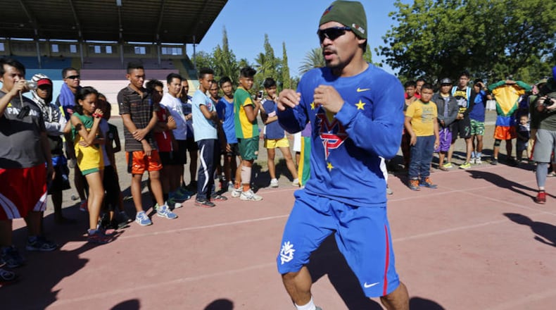 Nike no longer will pay Manny Pacquiao to promote its brand. (Jeoffrey Maitem / Getty Images)