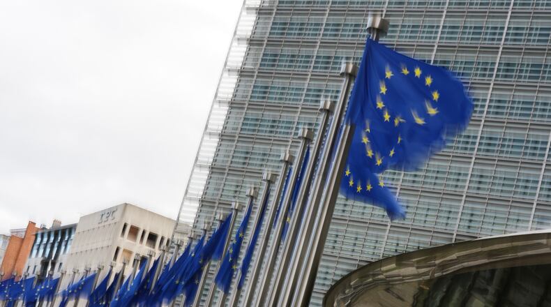 European Union flags flap in the wind outside EU headquarters in Brussels, Tuesday, May 12, 2026. (AP Photo/Virginia Mayo)