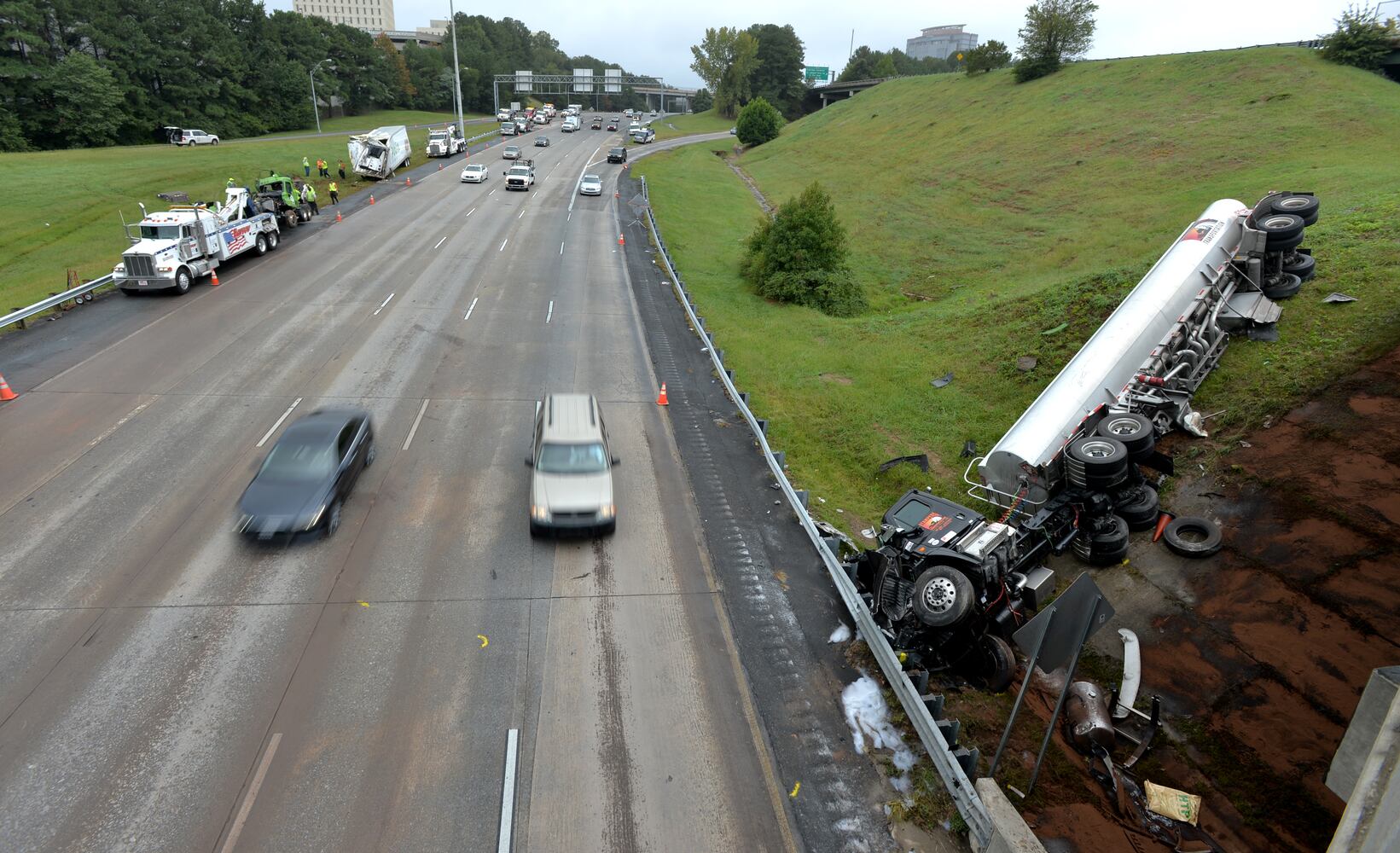I-285 crash: Trucks plunge off interstate onto Ga. 400