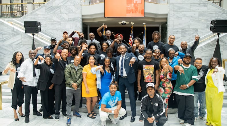 The graduates of the Rico Wade Music Executive Training Program gather for a group photo in City Hall with top music executives and guest speakers of the program on July 29, 2024.