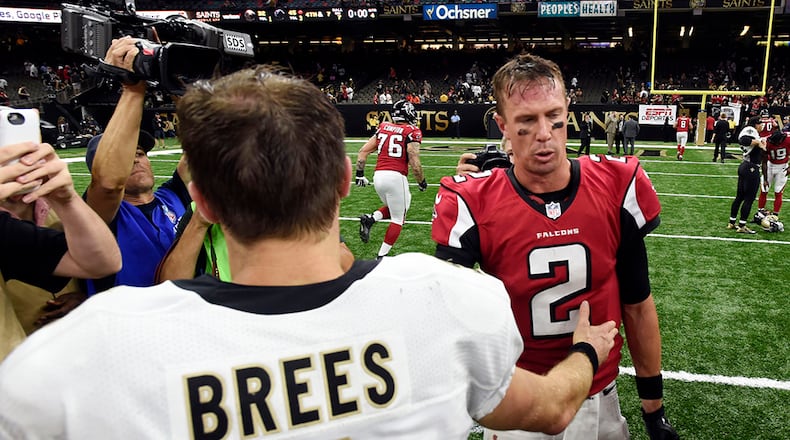 New Orleans Saints quarterback Drew Brees greets Atlanta Falcons quarterback Matt Ryan (2) after an NFL football game in New Orleans, Monday, Sept. 26, 2016. The Falcons won 45-32.