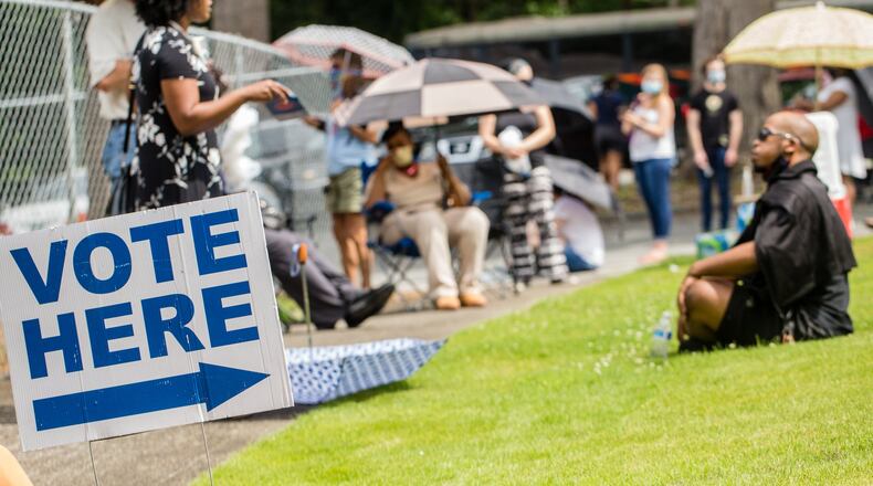 Voters waited three to five hours, at times in the rain, to cast ballots at New Beginnings Full Gospel Church during the Georgia primary. (Jenni Girtman for The Atlanta Journal-Constitution)