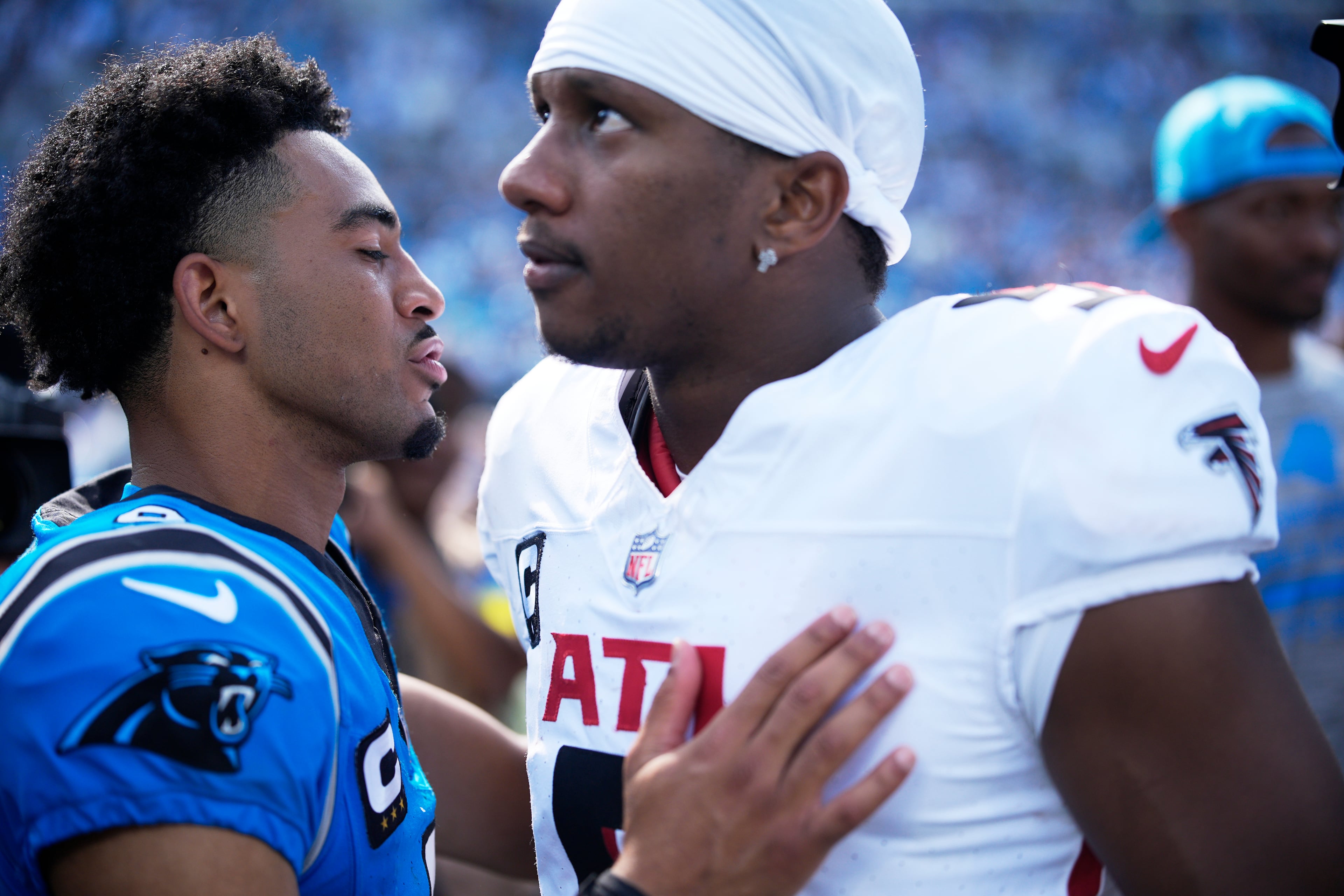 Panthers quarterback Bryce Young meets Falcons QB Michael Penix Jr. after Carolina's win in September.