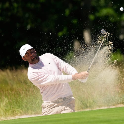 Scottie Scheffler hits from the bunker on the second hole during a practice round for the U.S. Open golf tournament at Shinnecock Hills Golf Club in Southampton, N.Y., Tuesday, June 16, 2026.(AP Photo/David J. Phillip)