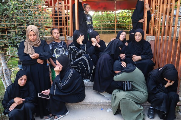 Palestinian women mourn for the relatives killed in an Israeli strike, at Nasser Hospital in Khan Younis, southern Gaza Strip, Tuesday, June 17, 2025. (AP Photo/Mariam Dagga)