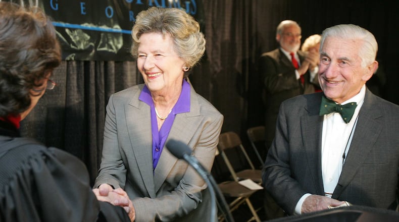 Dr. John Galambos, right, stands beside his wife of six decades, Sandy Springs' first mayor Eva Galambos, as she's sworn in the night the city was incorporated. Dr. Galambos died surrounded by his family May 29, 2019.