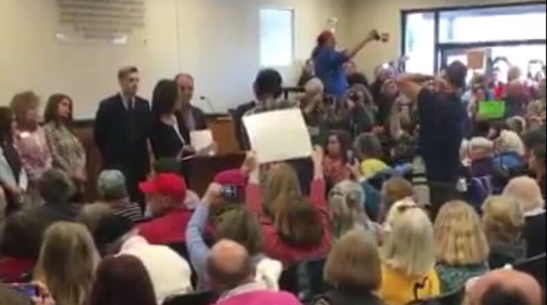 Protesters packed a meeting with aides to Georgia's congressmen in Greensboro on Feb. 10, 2017. Greg Bluestein, gbluestein@ajc.com