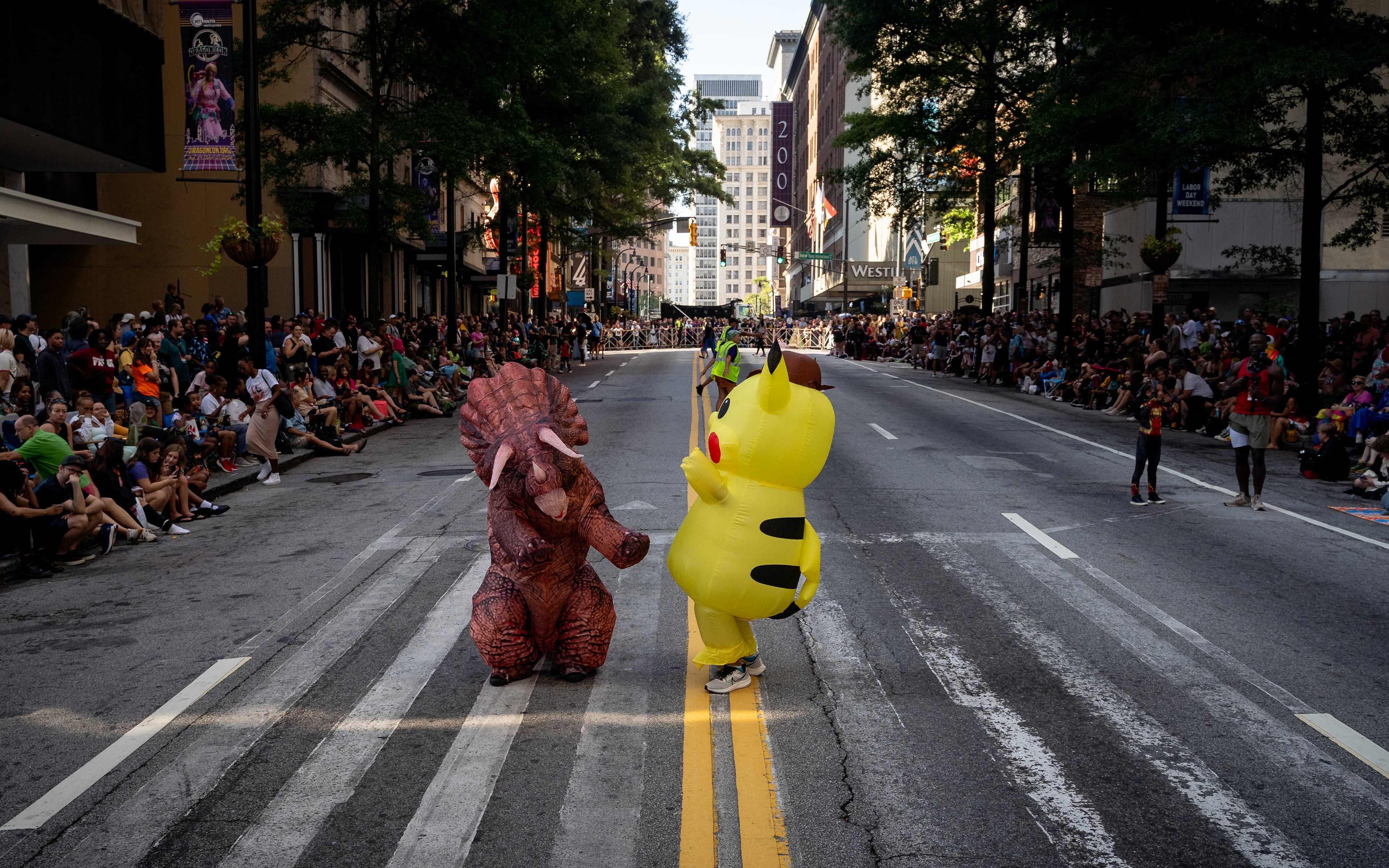 Thousands lined up along Peachtree Street on Saturday morning, August 31, 2024, for the annual Dragon Con parade in Atlanta. (Ben Hendren for The Atlanta Journal-Constitution)