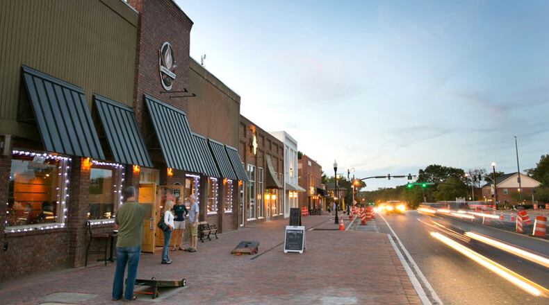 Main Street (Ga. 9) in downtown Alpharetta. An engineering consultant has completed a study on making the city’s streets safer and more convenient to pedestrians. JASON GETZ/AJC FILE