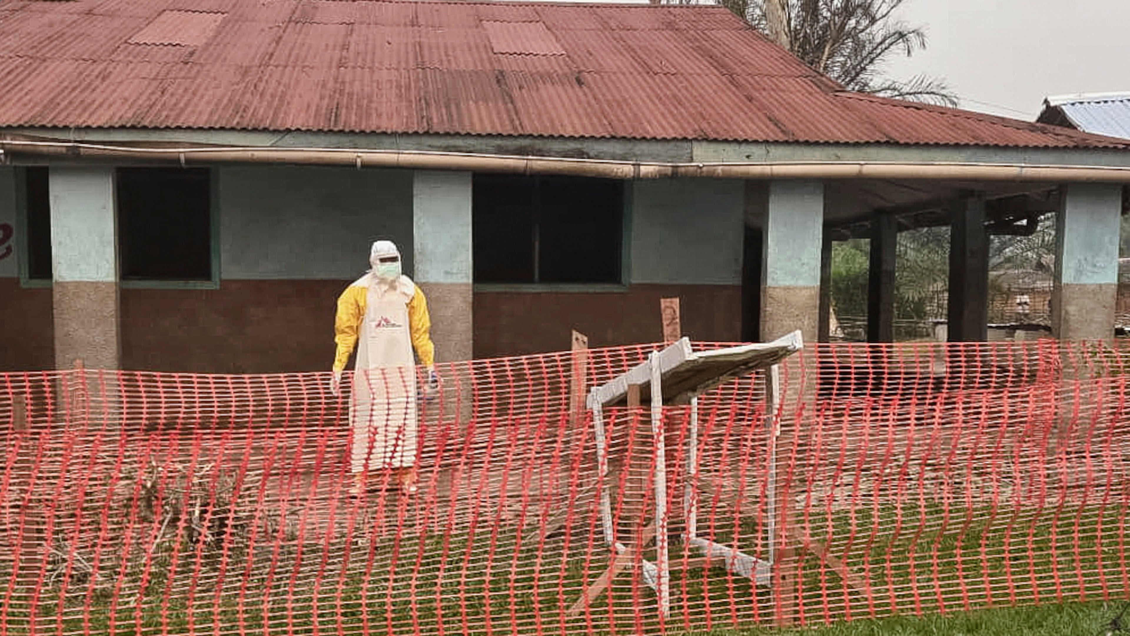 In this photo provided by Doctors Without Borders, a man wearing protective clothing stands outside an Ebola treatment center in the remote Bulape Health Zone, Kasaï province, the Democratic Republic of Congo, Sunday, Sept 7, 2025, that was set up following the outbreak of the Zaire strain of the Ebola virus. (MSF via AP)