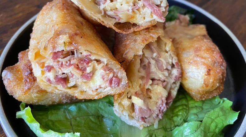 For the Reuben egg roll at Goldberg’s Fine Foods, the fillings are encased in a wonton wrapper, instead of rye bread. Angela Hansberger for The Atlanta Journal-Constitution