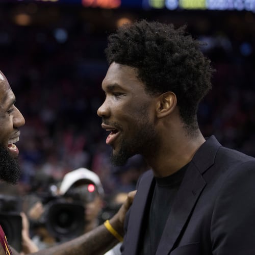 FILE - Cleveland Cavaliers' LeBron James, left, talks with Philadelphia 76ers' Joel Embiid, right, of Cameroon, after the second half of an NBA basketball game, April 6, 2018, in Philadelphia. (AP Photo/Chris Szagola, File)