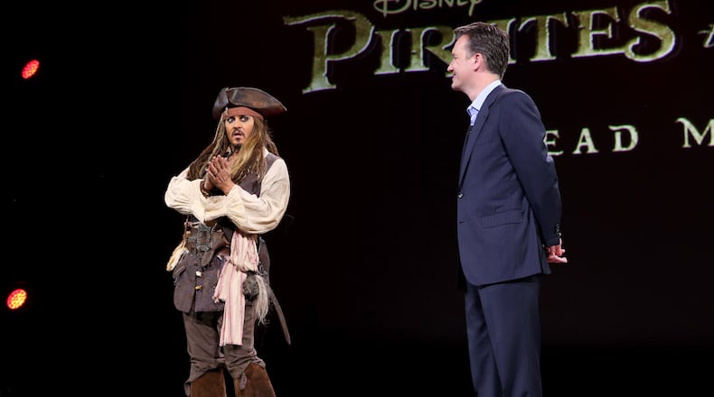 ANAHEIM, CA - AUGUST 15: Actor Johnny Depp, dressed as Captain Jack Sparrow, of PIRATES OF THE CARIBBEAN: DEAD MEN TELL NO TALES (L) and President of Walt Disney Studios Motion Picture Production Sean Bailey took part today in "Worlds, Galaxies, and Universes: Live Action at The Walt Disney Studios" presentation at Disney's D23 EXPO 2015 in Anaheim, Calif. (Photo by Jesse Grant/Getty Images for Disney)