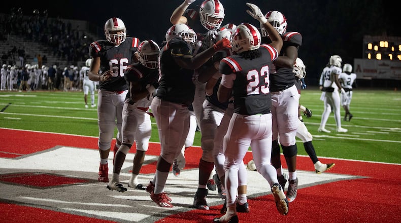 Archer players celebrate at a GHSA high school football game between Archer High School and Norcross High School in Lawrenceville, GA., on Friday, November 5, 2021. Archer won 9-0. (Photo/Jenn Finch)