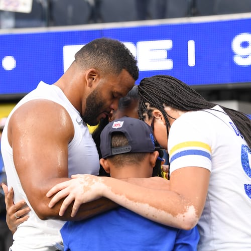 Los Angeles Rams defensive end Aaron Donald huddles with his family before an NFL football game against the New York Giants in Inglewood, Calif., Monday, Sept. 21, 2026. (AP Photo/Katie Chin)