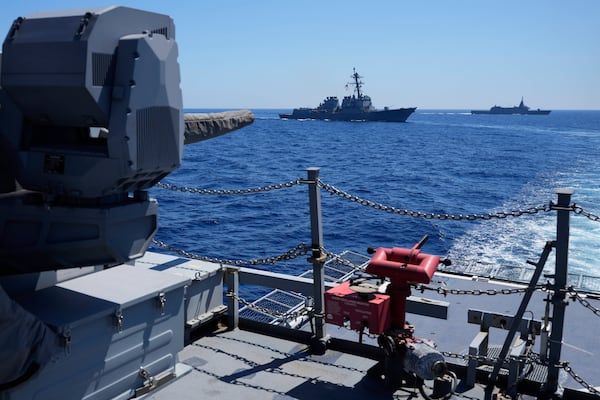 Philippine Navy Ship Jose Rizal leads manuevers with US Navy USS Shoup (DDG86), center, and Japanese Maritime Self-Defence Force (JMSDF) frigate JS Noshiro. right, during the Philippines United States Japan Multilateral Maritime Cooperative Activity off a disputed South China Sea shoal on Friday, March 28, 2025. (AP Photo/Aaron Favila)