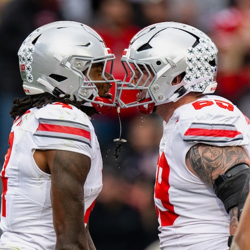Ohio State wide receiver Jeremiah Smith (4) celebrates a touchdown with offensive lineman Ian Moore (69) during the first half of an NCAA college football game against Purdue, Saturday, Nov. 8, 2025, in West Lafayette, Ind. (AP Photo/Doug McSchooler)