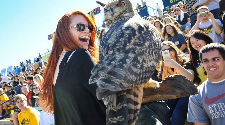 Kennesaw State student Kimberly Panik reacts to the school’s mascot, an owl named Sturgis.