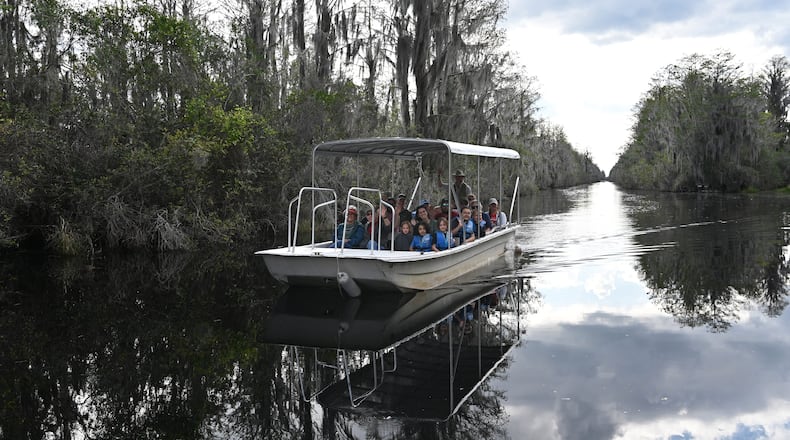 Visitors enjoy a boat tour of the Okefenokee Swamp on Monday, Mar. 18, 2024, in Folkston, Ga. (Hyosub Shin/AJC 2024)