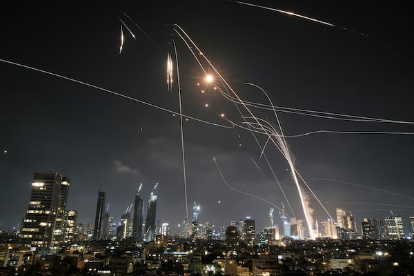 FILE - Israeli Iron Dome air defense system fires to intercept missiles over Tel Aviv, Israel, on June 13, 2025. (AP Photo/Leo Correa, File)