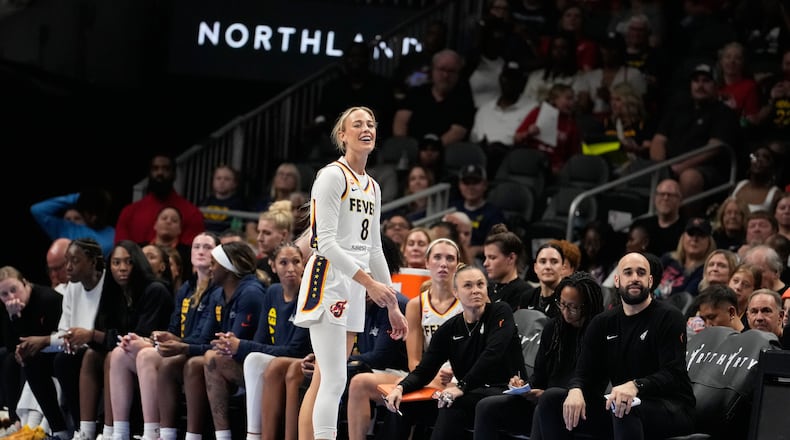 Indiana Fever guard Sophie Cunningham (8) reacts to a foul in the first half of an WNBA basketball game against the Atlanta Dream Sunday, Aug. 16, 2026, in Atlanta. (AP Photo/Brynn Anderson)