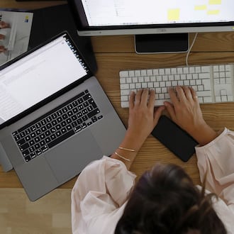 "Rigid workplace policies do not only affect mothers. Everyone benefits when work cultures recognize people as whole human beings," writes Amanda Forgione (Stefan Wermuth/Bloomberg).