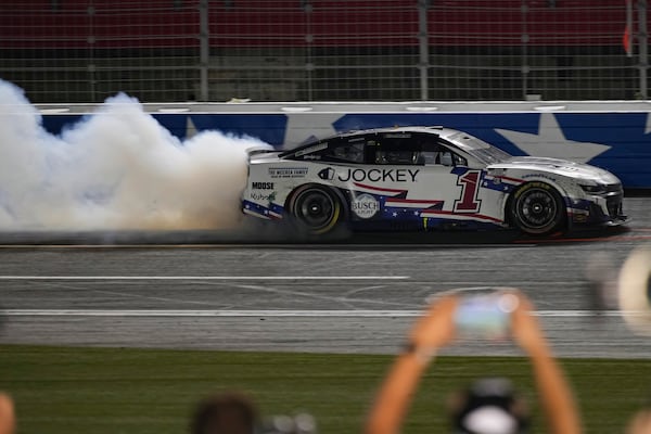 Ross Chastain does a burnout after winning a NASCAR Cup Series auto race at Charlotte Motor Speedway, Sunday, May 25, 2025, in Concord, N.C. (AP Photo/Matt Kelley)