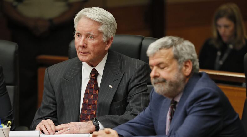 Defense attorney Don Samuel grimances as Tex McIver, left, looks on wide-eyed after the jury found him guilty of felony murder last week. Bob Andres / bandres@ajc.com