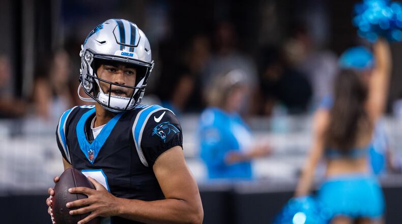 Carolina Panthers quarterback Bryce Young (9) warms up during the NFL football team's fan fest Friday, July 31, 2026, in Charlotte, N.C. (AP Photo/Scott Kinser)