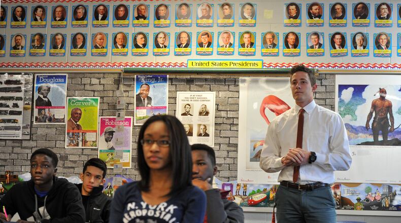 January 15, 2015 Lawrenceville - Andy Dugger (standing), listens to presentation during his AP US History class at Central Gwinnett High School in Lawrenceville on Thursday, January 15, 2015. Some Gwinnett County residents say the school district's history courses, particularly Advanced Placement U.S. History, do not properly reflect many moments and people in American history and much of it is anti-American. The critics want Gwinnett, the state's largest school district, to return to the prior AP U.S. history framework and exam. The criticism in Gwinnett is part of a national debate that's emerged in recent months about the course, led by conservatives, after some changes were made to the coursework in 2014. HYOSUB SHIN / HSHIN@AJC.COM Teacher Andy Dugger (standing) listens to presentation during his AP US History class at Central Gwinnett High School in Lawrenceville. HYOSUB SHIN / HSHIN@AJC.COM