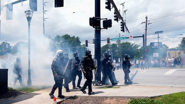Dekalb County Sheriff's deputies deploy gas to move proteters during a No Kings Day protest, Saturday, June 14, 2025, in Dekalb County, near Atlanta. (AP Photo/Mike Stewart)