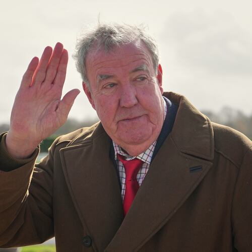 FILE - TV presenter Jeremy Clarkson waves to the media as he arrives on day four of the 2026 Cheltenham Festival in Cheltenham, England, on March 13, 2026. (AP Photo/Dave Shopland, File)